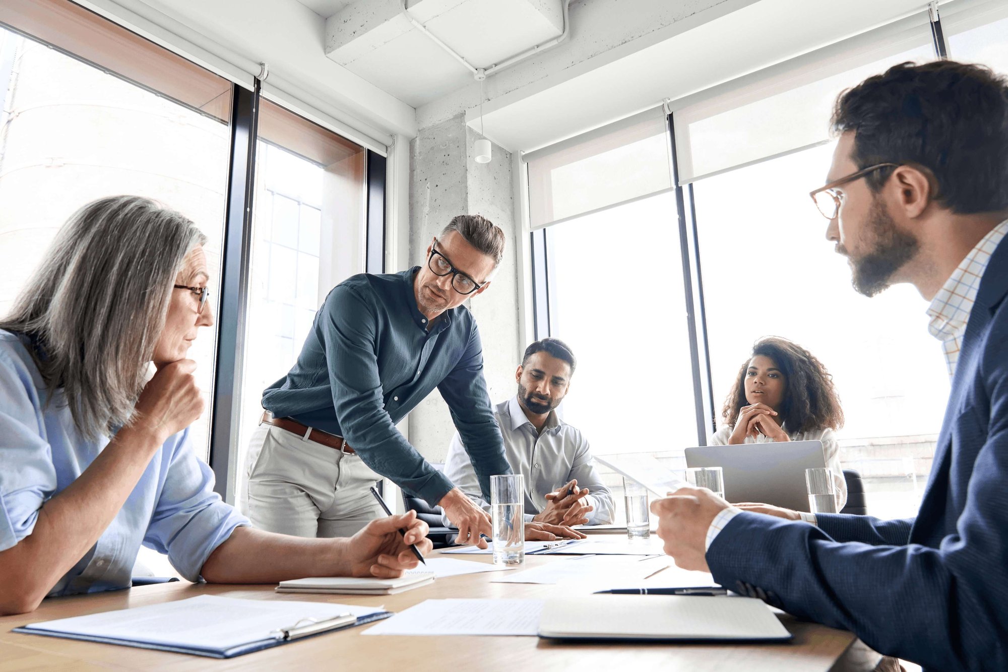 SXA stock images - team of professionals discussing a proposal at a conference table (1)
